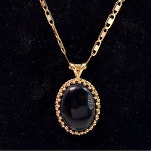 14 karat gold chain with black oval pendant